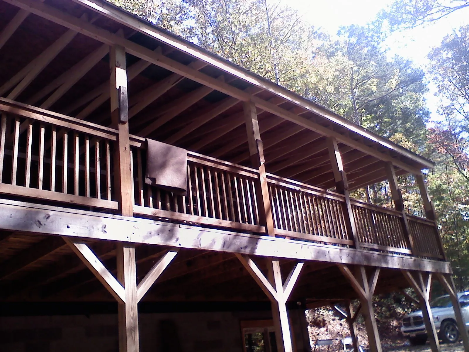 Timber framing under a new elevated porch and deck — Roof Leak Repair in North Washington by Roofing Brothers